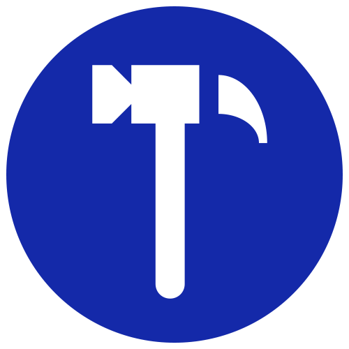 Blue circular road sign with a white hammer icon indicating a work zone or construction area