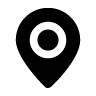 Black location pin icon with white center circle on a light background