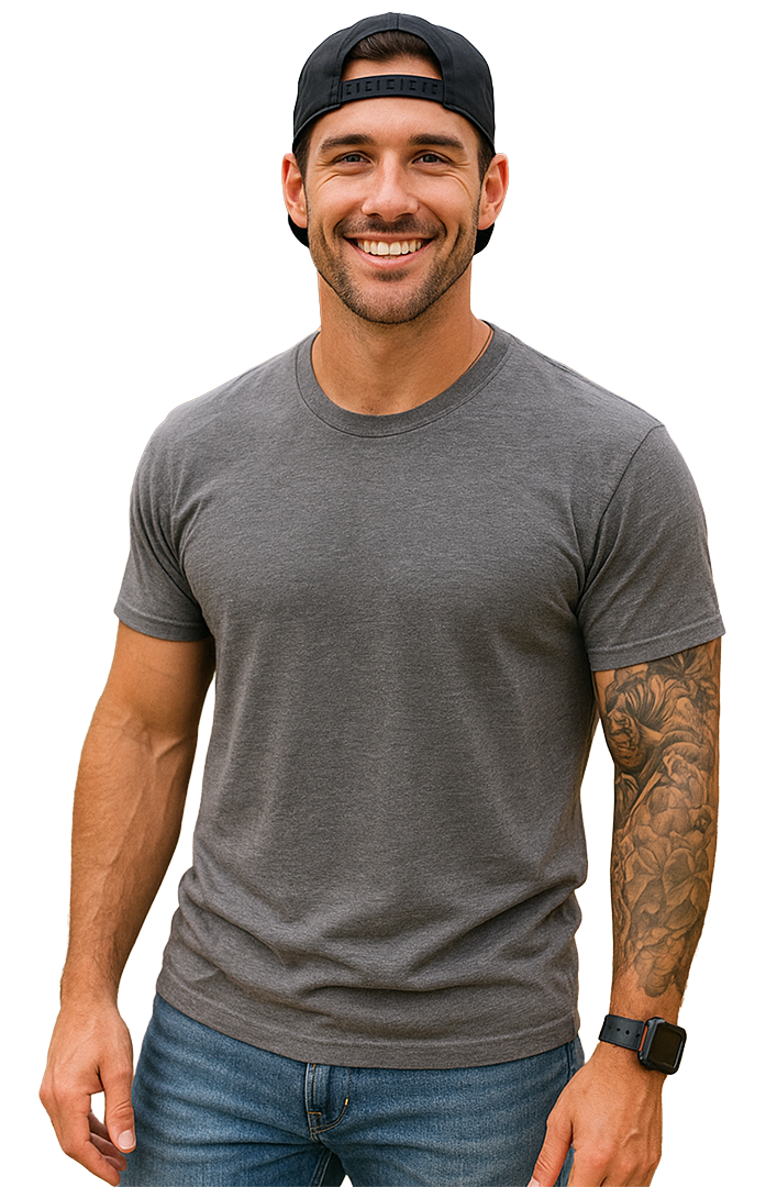 Smiling man in a gray T-shirt, jeans, and backward cap, standing against a white background.