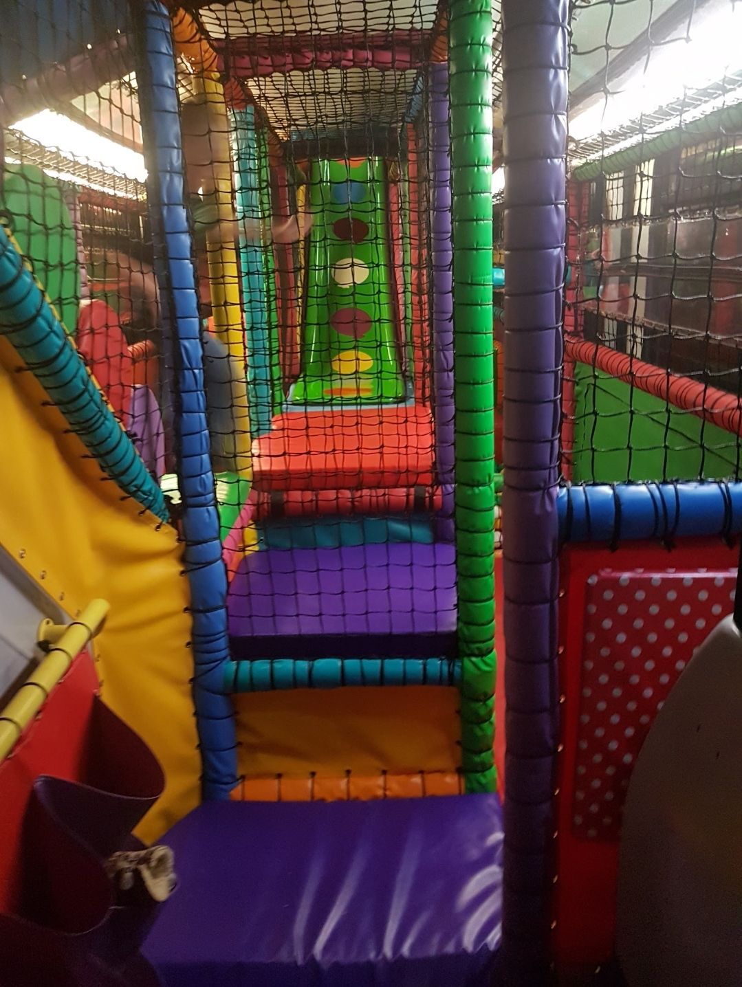 A colorful playground with a slide and stairs
