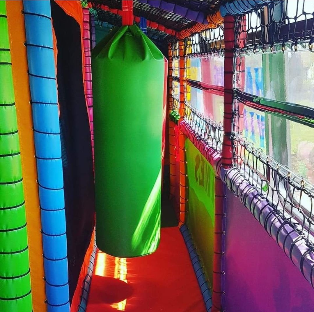 a green biff bash inside a soft play bus