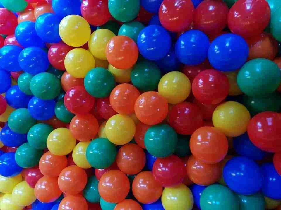A pile of colorful plastic balls in a ball pit