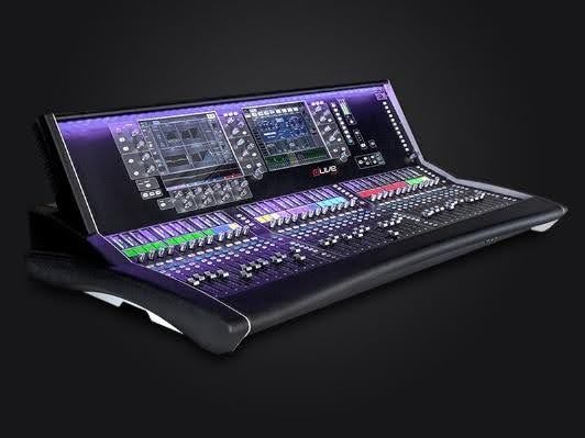 A mixer is sitting on top of a table on a black background.
