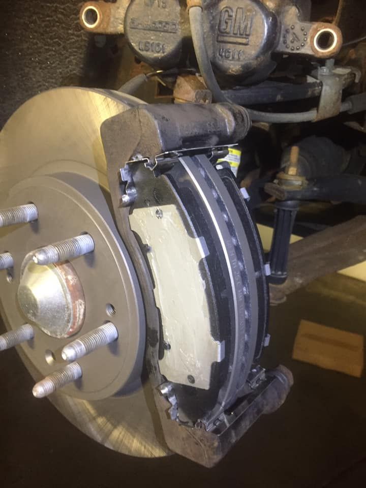 A close up of a brake disc on a car