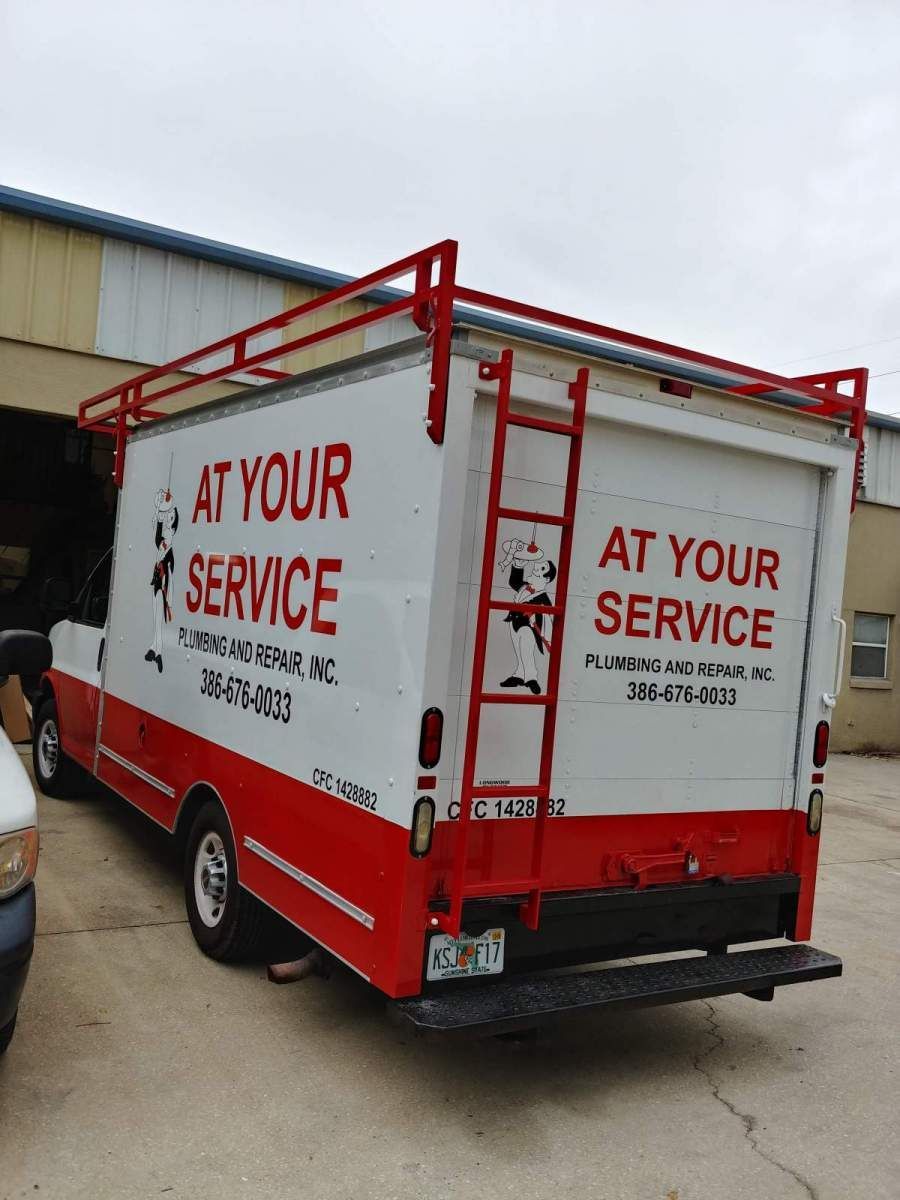 White and red service truck with