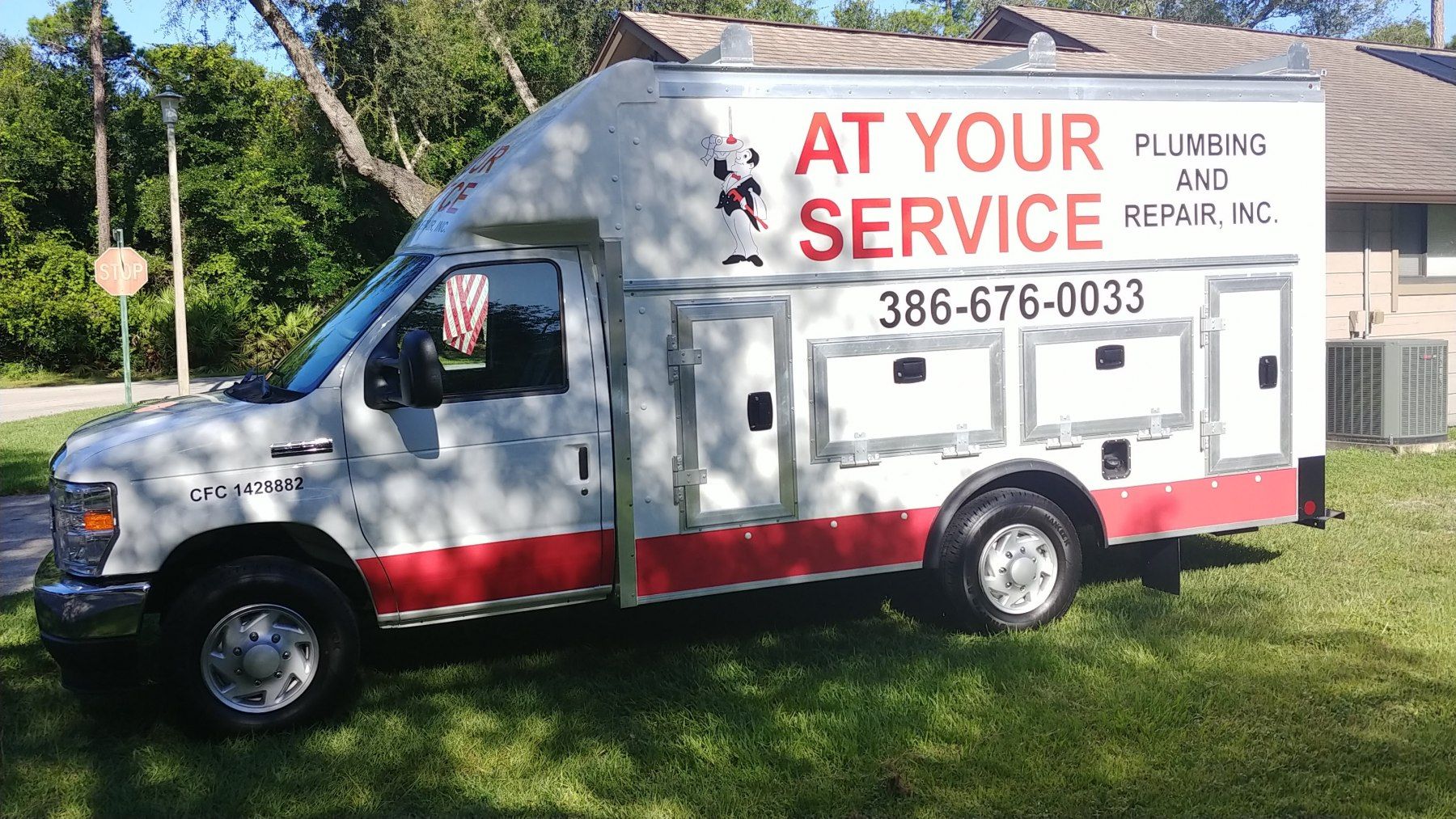 White service truck with red trim;