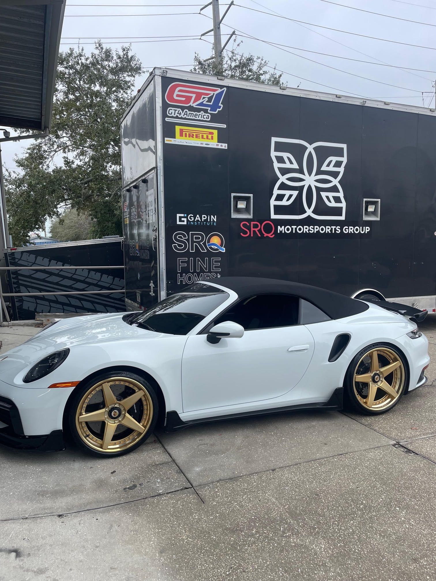 White Sports Car in Front of SRQ Motorsports in Sarasota, FL