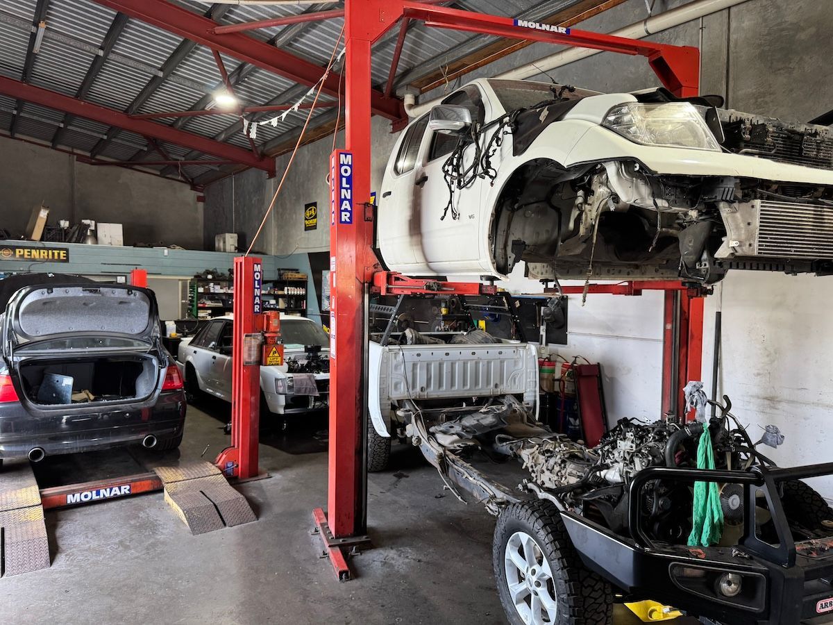 A Family Is Riding In A Car On A Road Trip — All Automotive Services In Bundaberg East, QLD