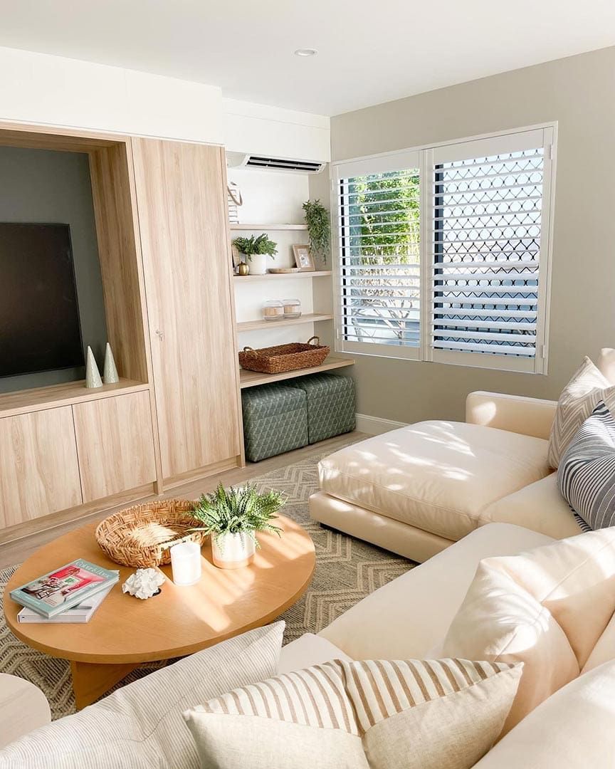 A Living Room With a Couch, Coffee Table, and Television — JIC Projects Pty Ltd in Runaway Bay, QLD