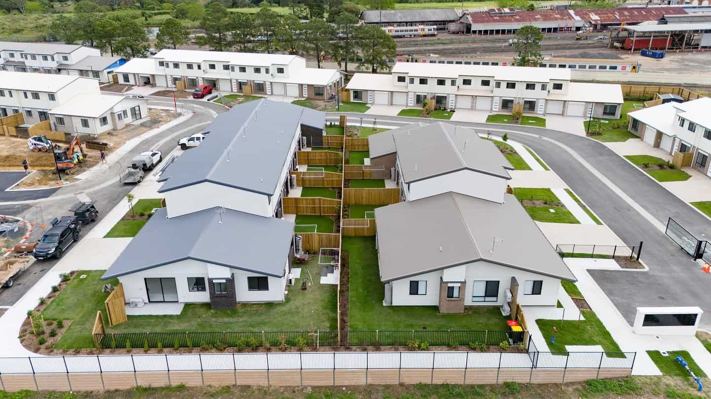 An Aerial View of a Row of Houses in a Residential Area — JIC Projects Pty Ltd in Runaway Bay, QLD