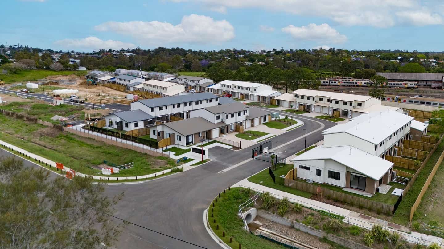 An Aerial View of a Residential Area With Lots of Houses and Trees — JIC Projects Pty Ltd in Runaway Bay, QLD