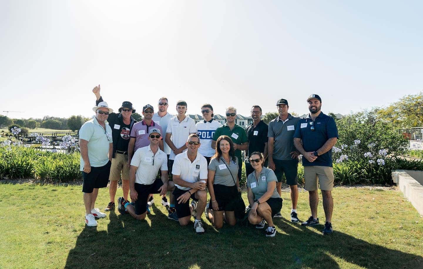 A Group Of People Standing Together Smiling — JIC Projects Pty Ltd in Runaway Bay, QLD
