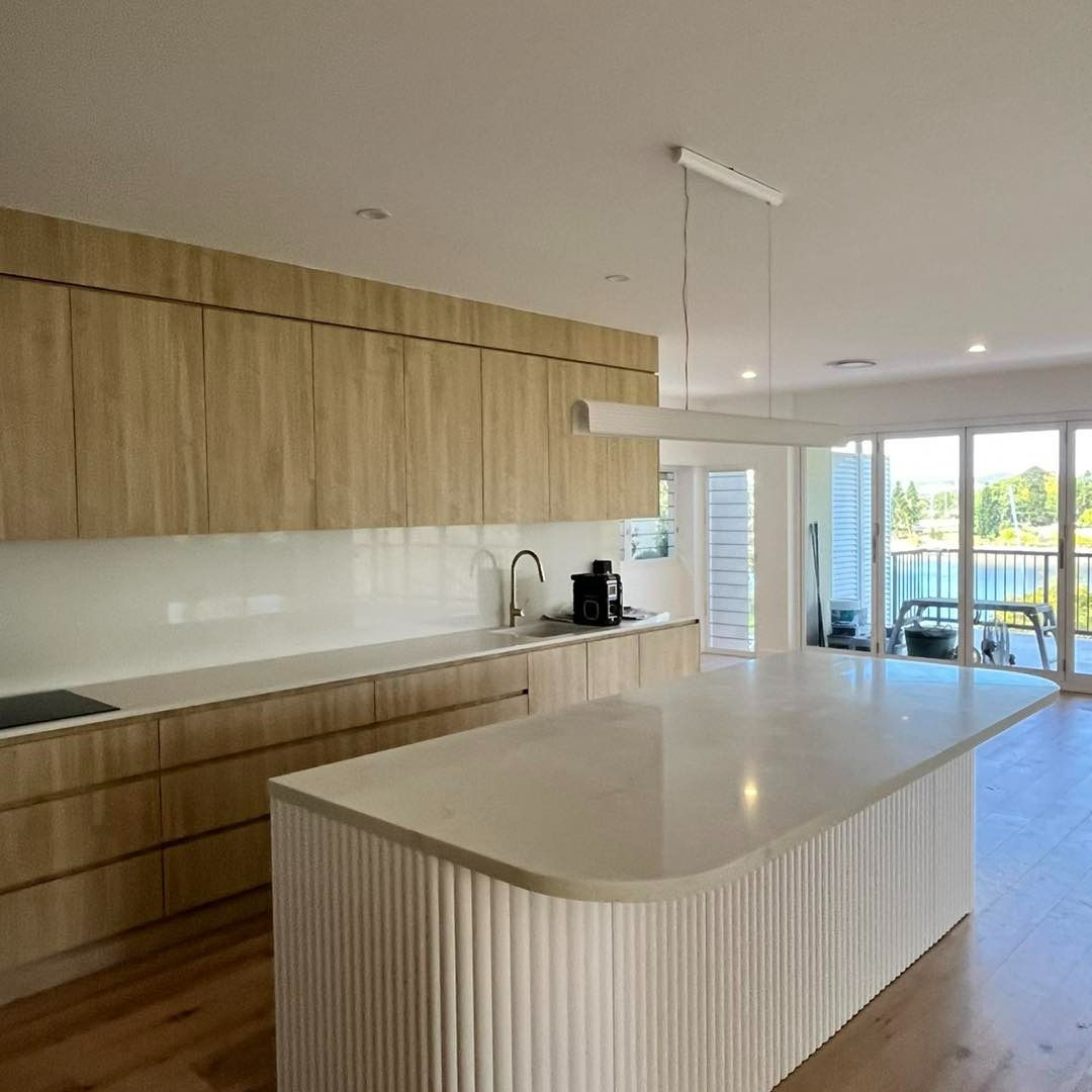 There is a Large Island in the Middle of the Kitchen — JIC Projects Pty Ltd in Runaway Bay, QLD