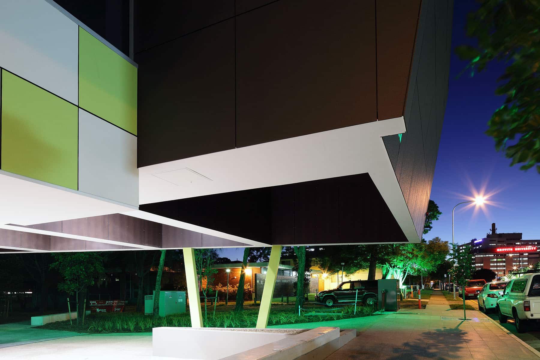 Modern Architecture With Colorful Panels at Night, Surrounded by Trees and Streetlights — JIC Projects Pty Ltd in Runaway Bay, QLDÂ