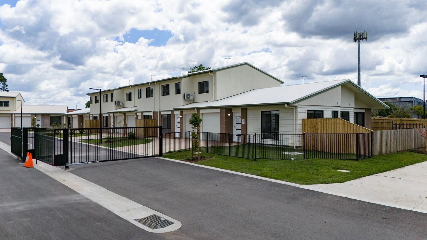 A Row of Houses in a Gated Residential Area — JIC Projects Pty Ltd in Runaway Bay, QLD