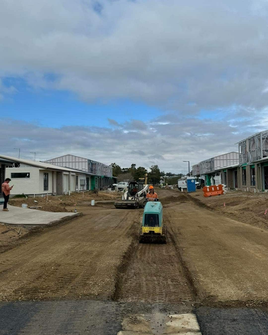 A Construction site With Builder Operating Machine On Dirt — JIC Projects Pty Ltd in Byron Bay, NSW