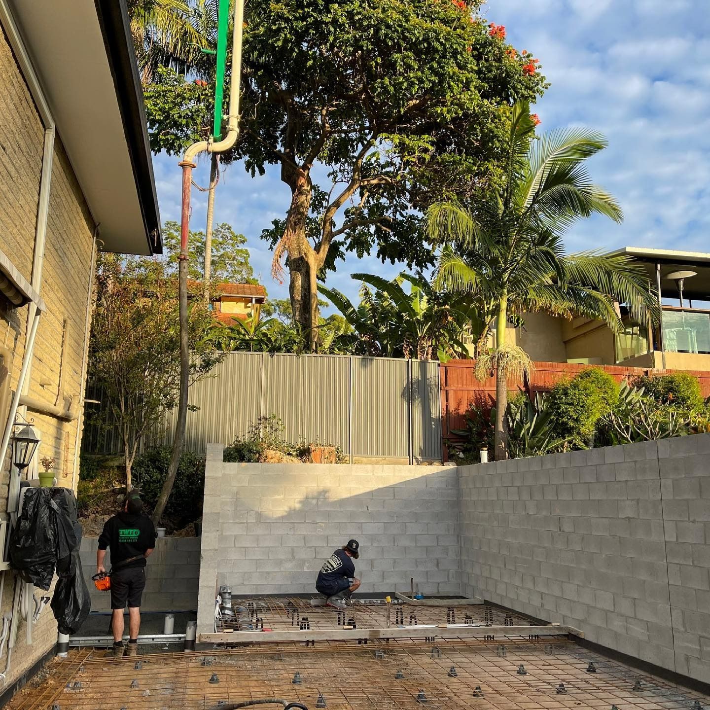 A Concrete Pump Pouring Concrete Into Backyard — JIC Projects Pty Ltd in Runaway Bay, QLD