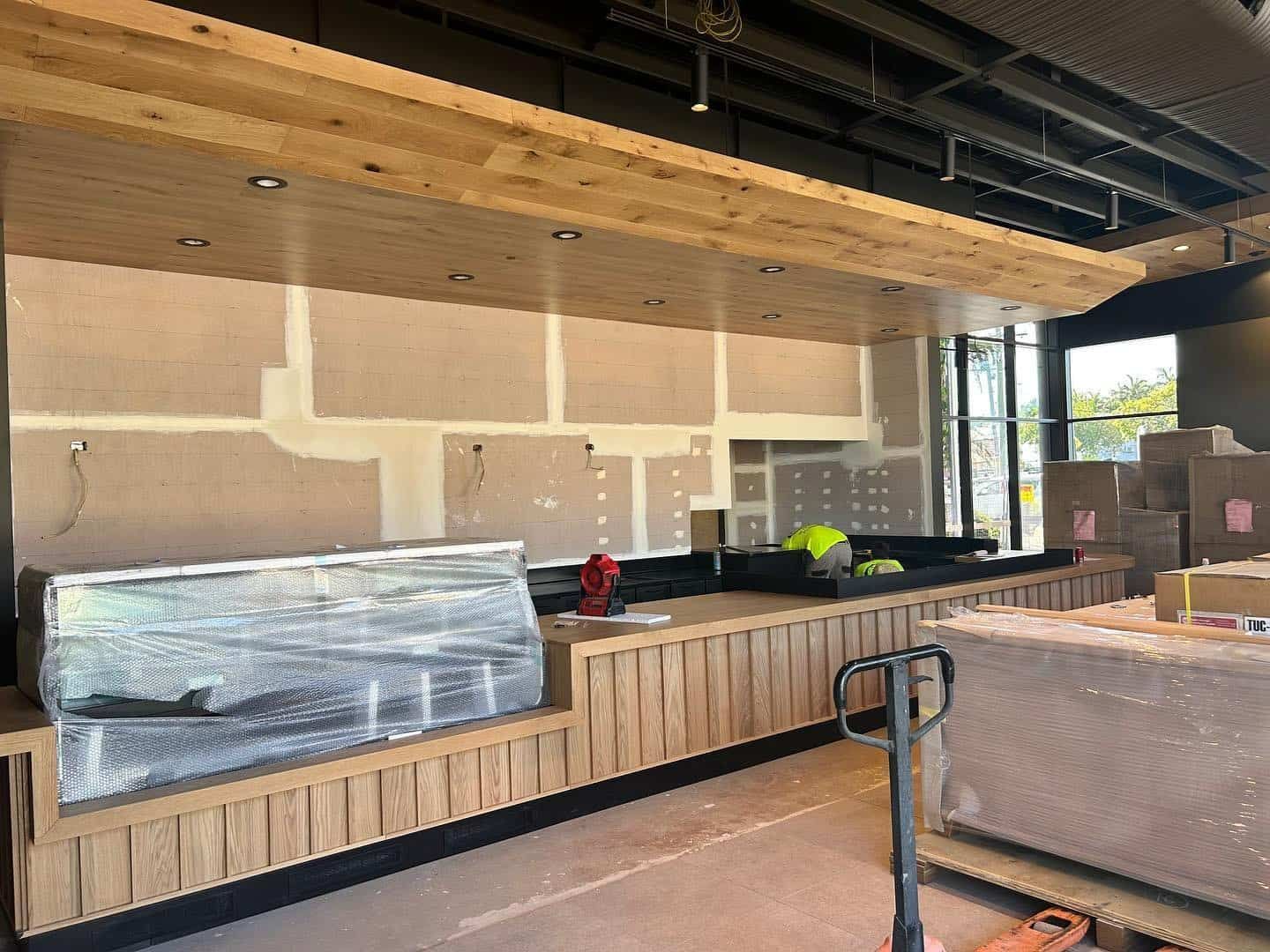 A Restaurant is Being Built With a Wooden Counter Top — JIC Projects Pty Ltd in Runaway Bay, QLD