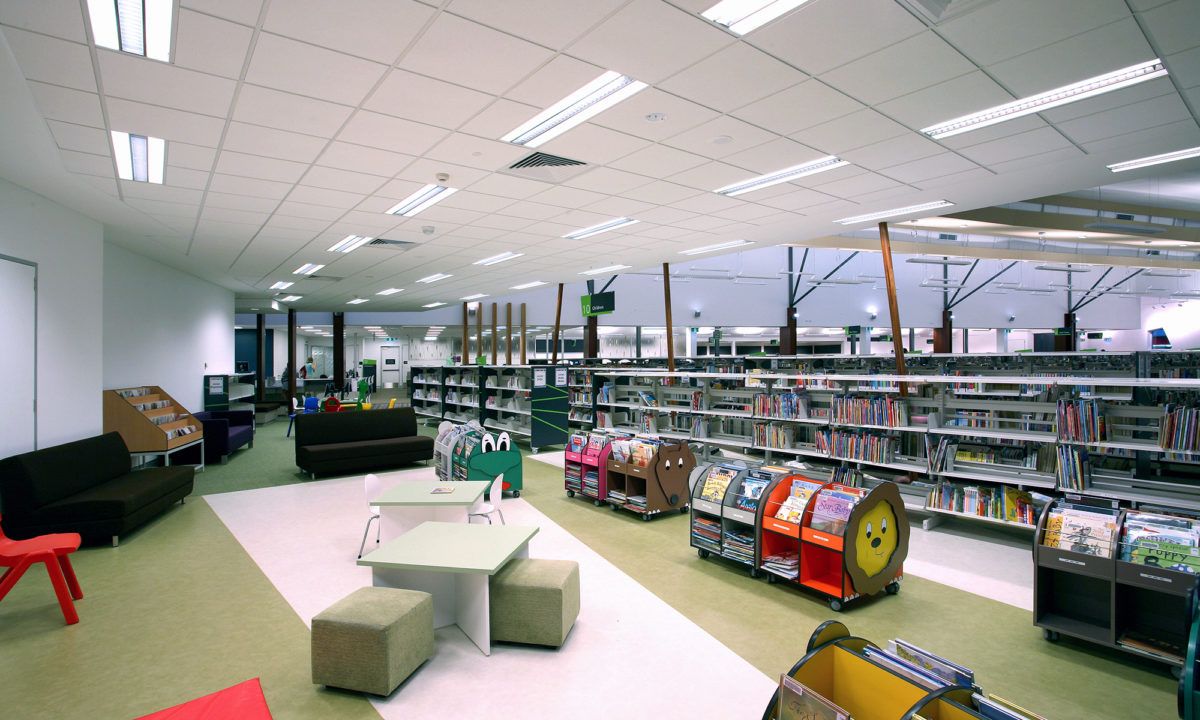 Bright and Modern Library Interior Featuring Colorful Seating and Bookshelves — JIC Projects Pty Ltd in Runaway Bay, QLD