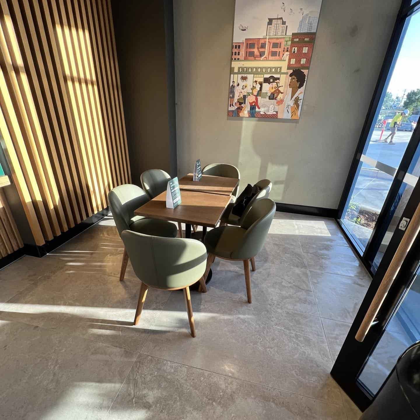 A Room With a Table and Chairs and a Painting on the Wall — JIC Projects Pty Ltd in Runaway Bay, QLD
