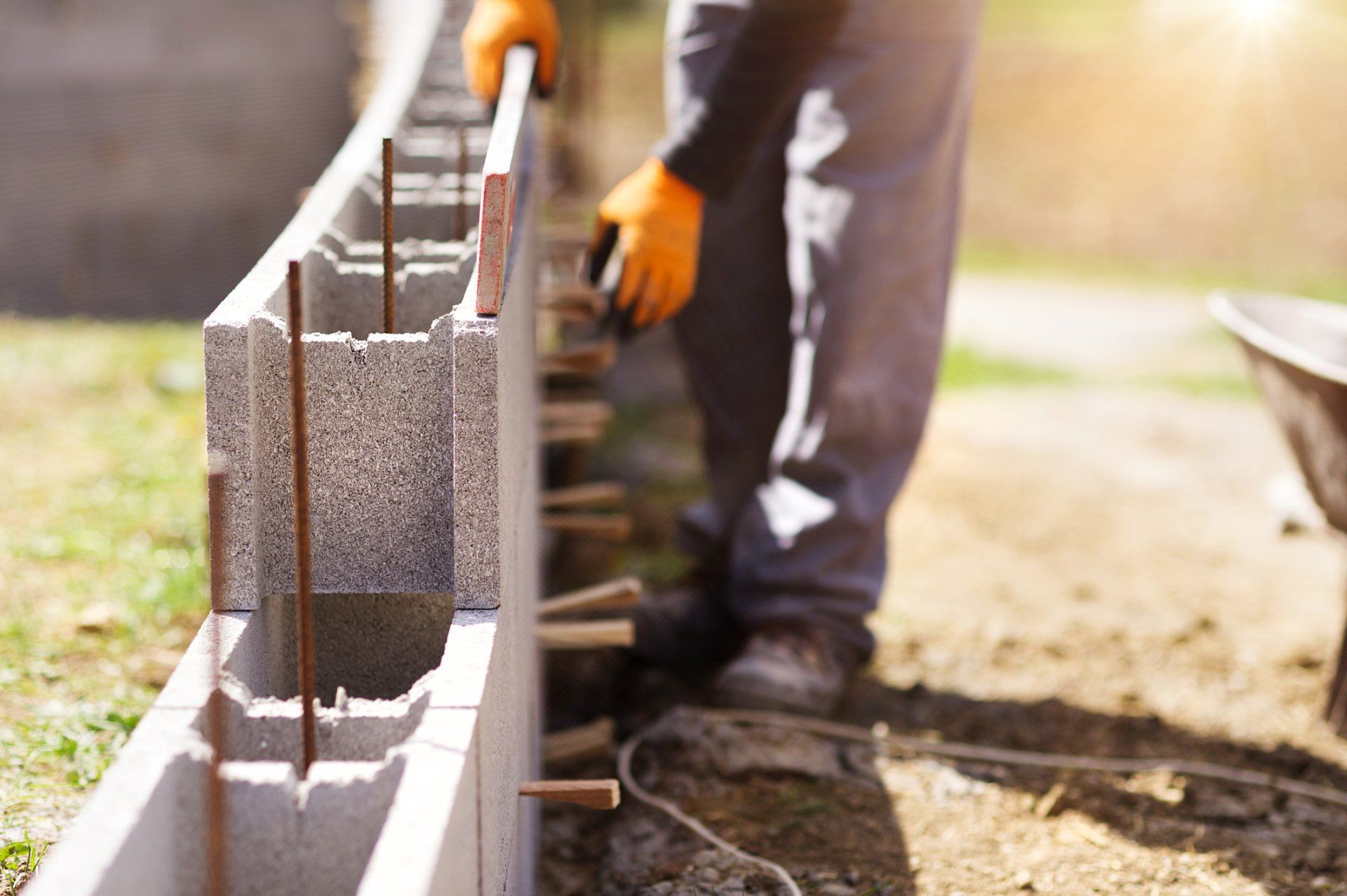 Man Placing Cinder Block - Allen, TX - Alpha Foundation Repair LLC Man Placing Cinder Block - Allen, TX - Alpha Foundation Repair LLC