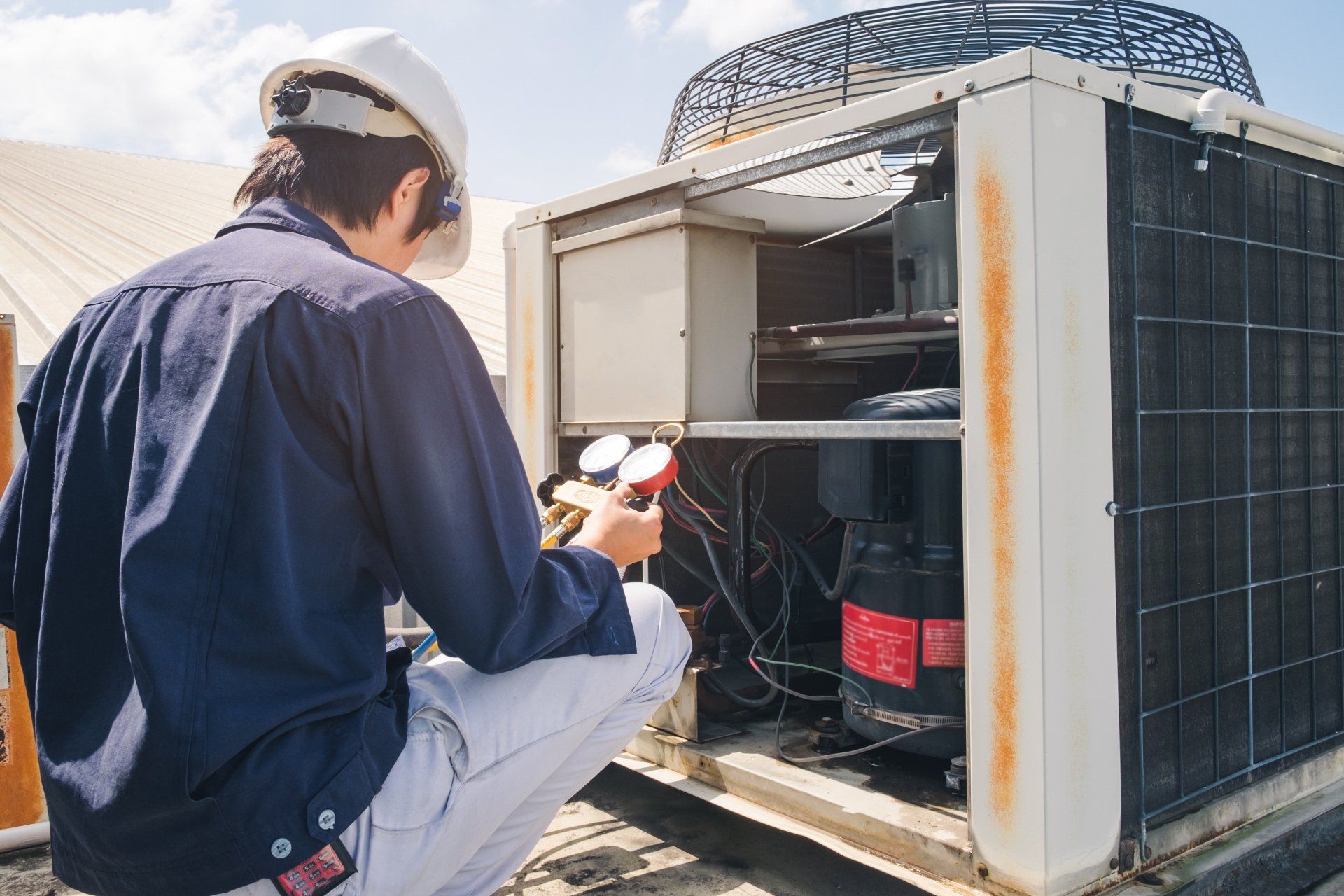 Technician Is Checking Air Conditioner - Allen, TX - Alpha Foundation Repair LLC