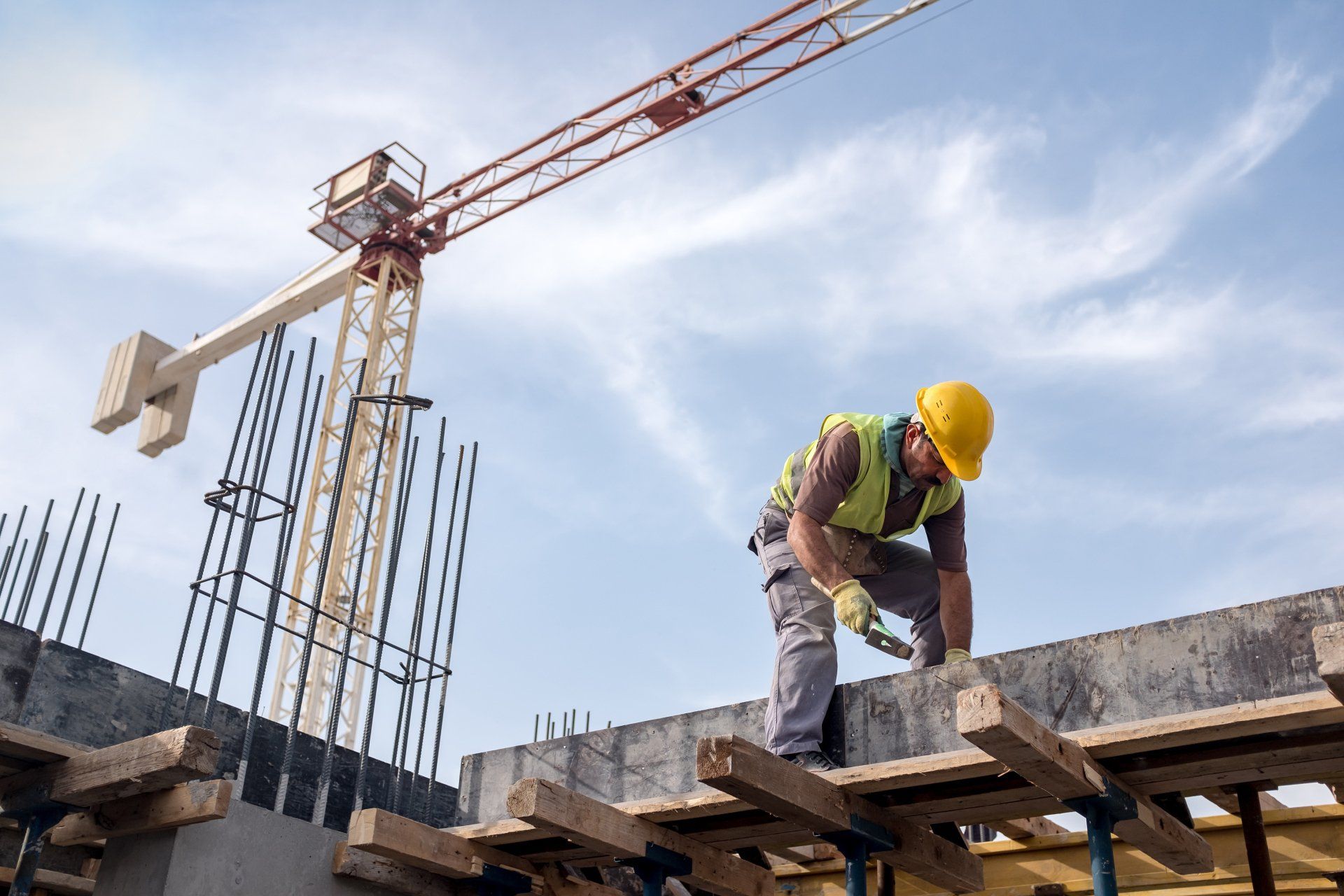 Worker At Construction Site Is Fixing The Form For The Beam - Allen, TX - Alpha Foundation Repair LLC