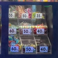 Toys and collectibles displayed on shelves in a brightly lit store with colorful packaging and figures.