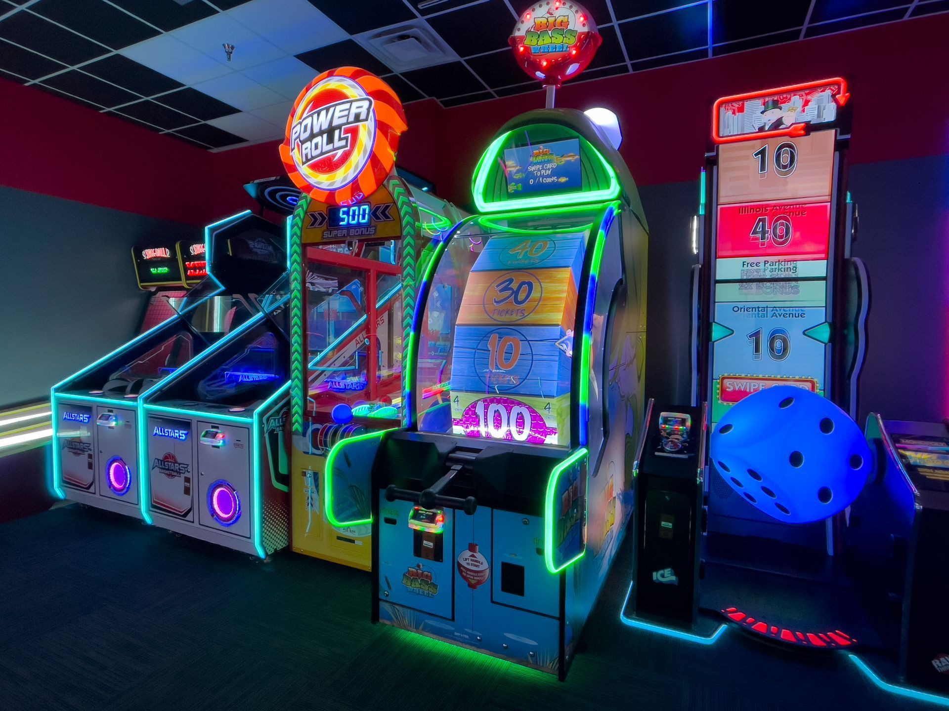Young woman using a colorful arcade game under a glowing translucent dome