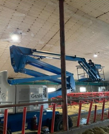A genie lift is being used in a building