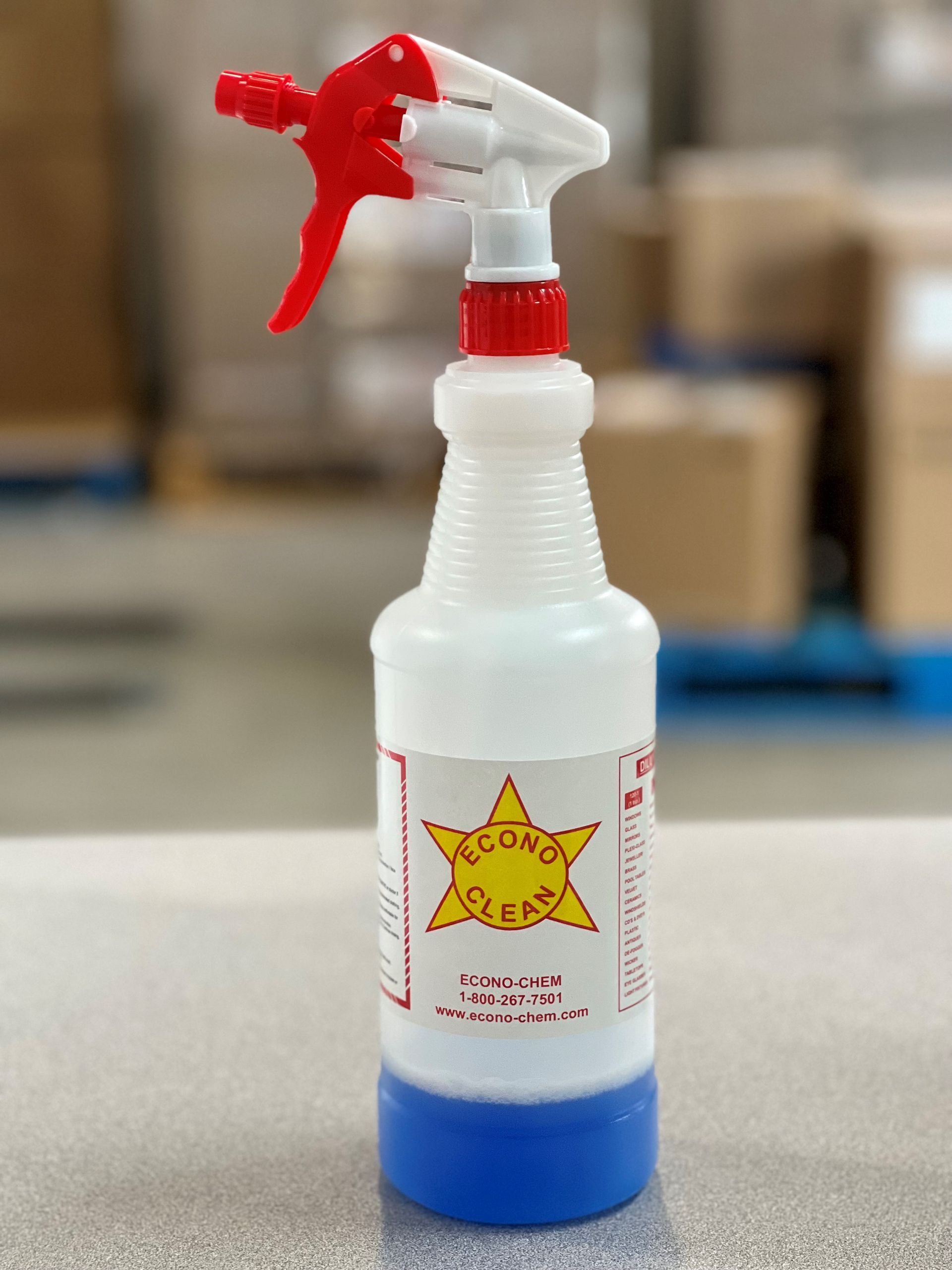 A spray bottle with a star on it is sitting on a table.