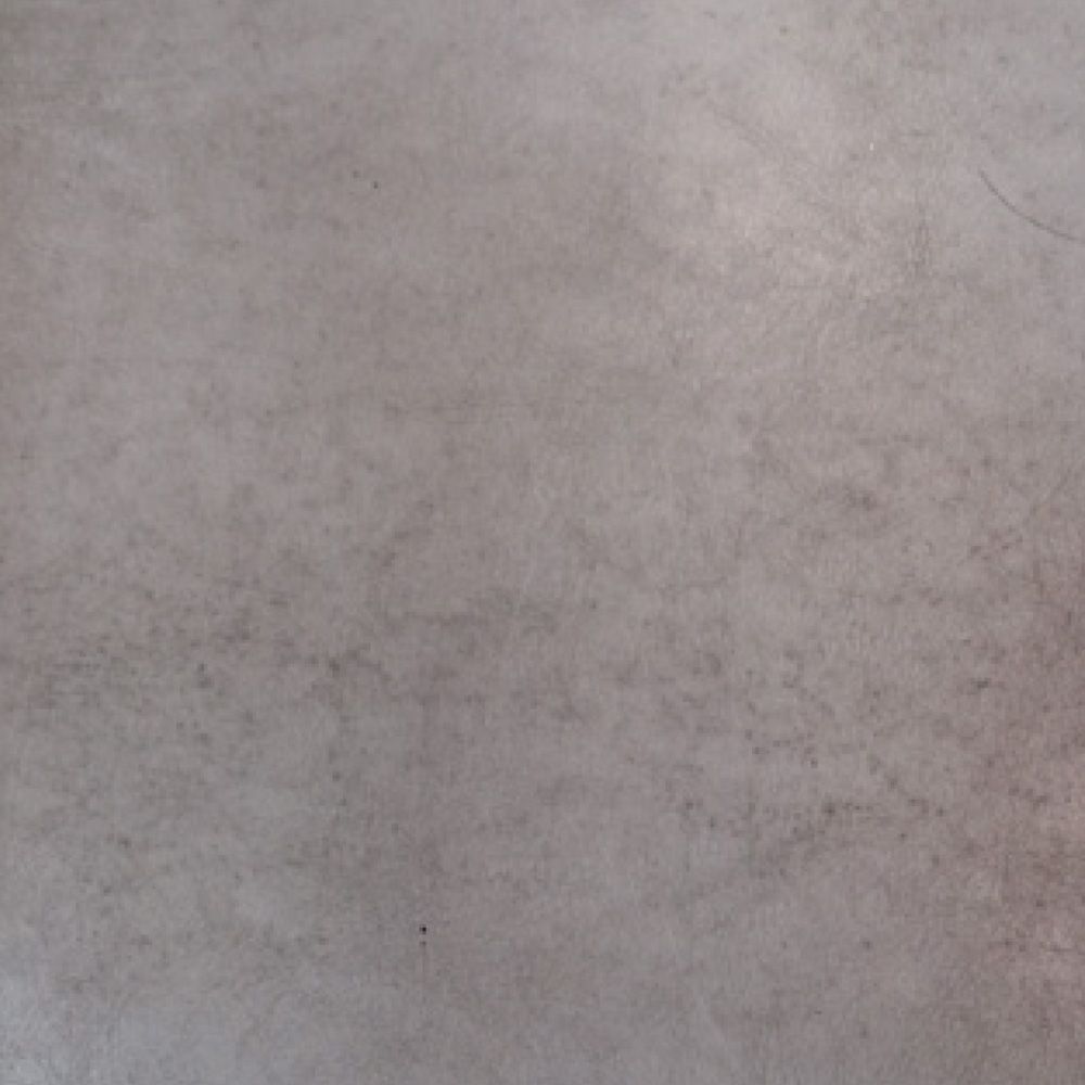 A close up of a gray tile floor.