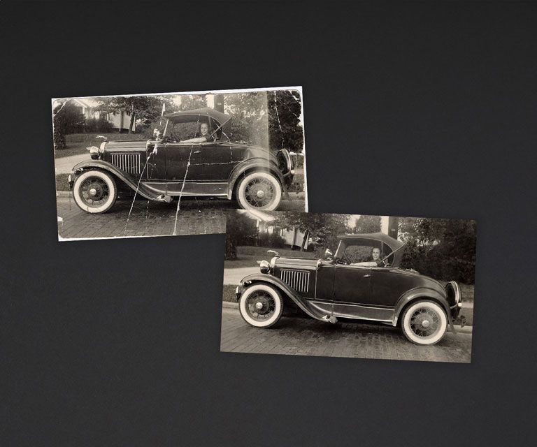 Restored black and white photo of an old automobile