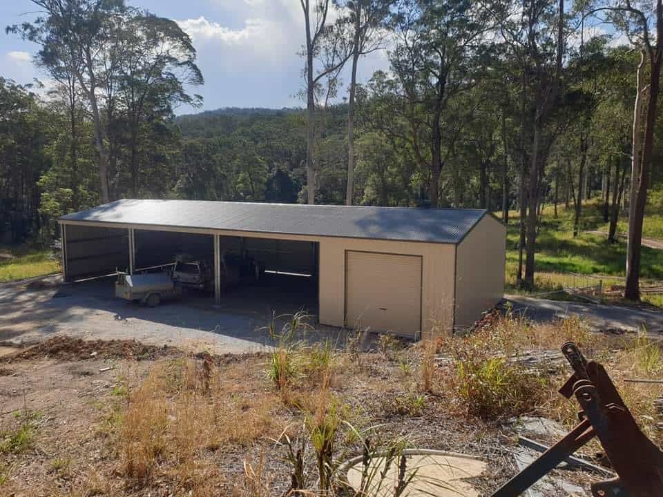 A Car is Parked in a Garage in the Middle of a Forest — Hastings Valley Sheds in South West Rocks, NSW