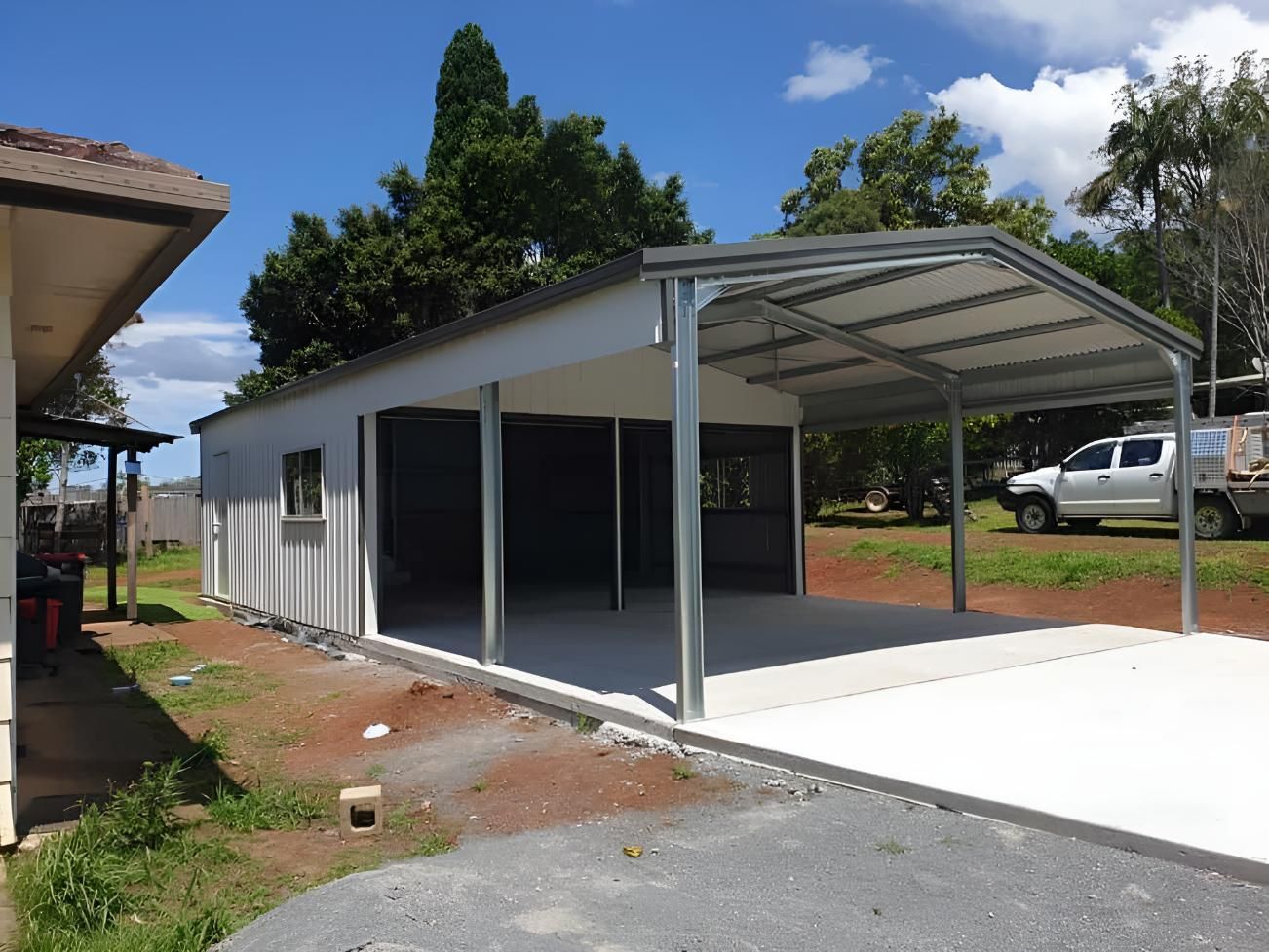 A White Truck is Parked in Front of a Garage — Hastings Valley Sheds in Kempsey, NSW