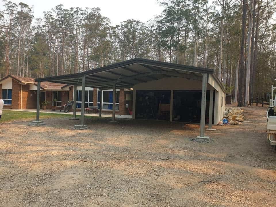 A Carport in Front of a House With Trees in the Background — Hastings Valley Sheds in Laurieton, NSW