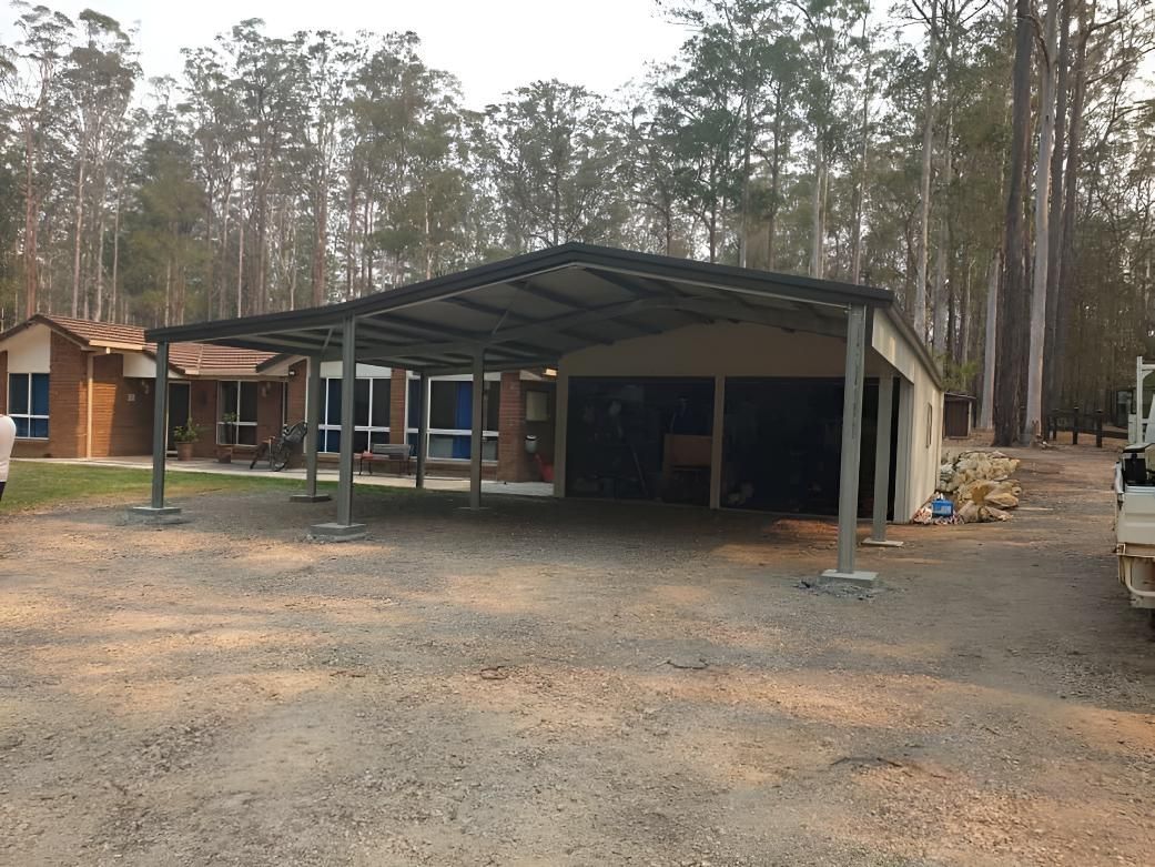 A Carport in Front of a House With Trees in the Background — Hastings Valley Sheds in Kempsey, NSW