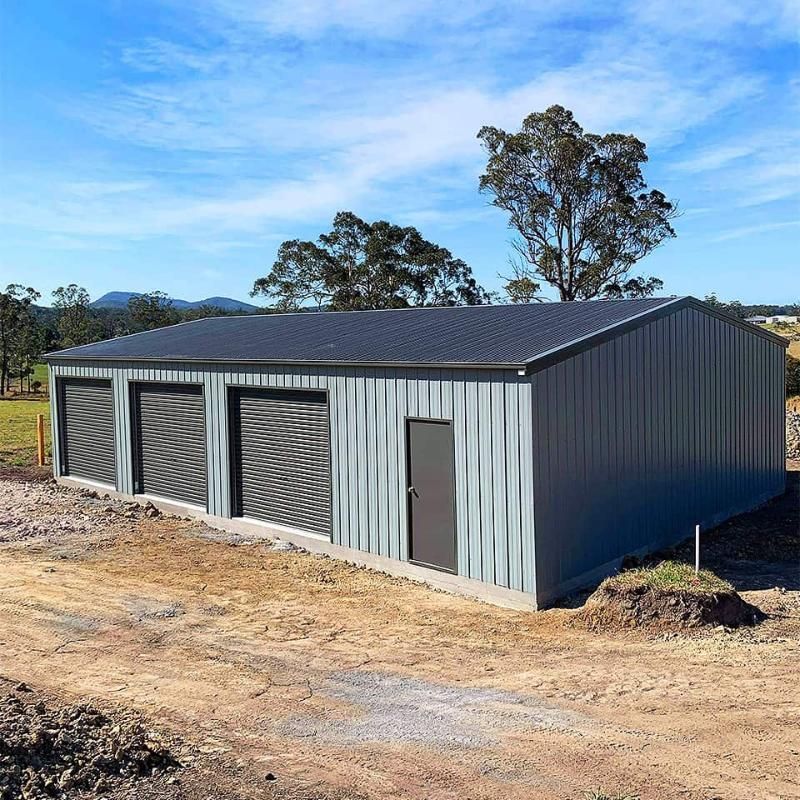 A Large Metal Shed With Three — Hastings Valley Sheds in Laurieton, NSW