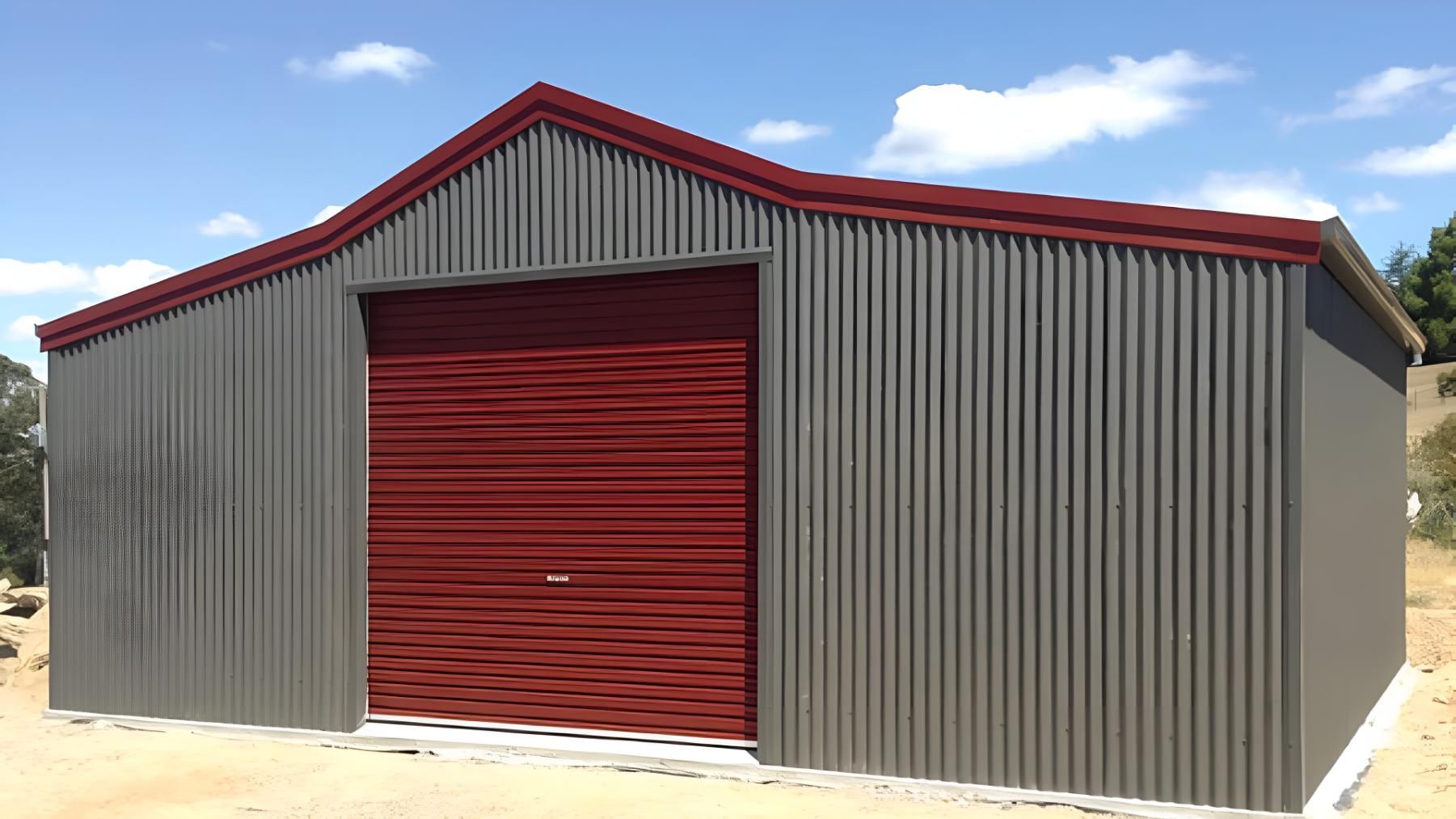 A Gray Metal Shed With a Red Garage Door — Hastings Valley Sheds in Wauchope, NSW