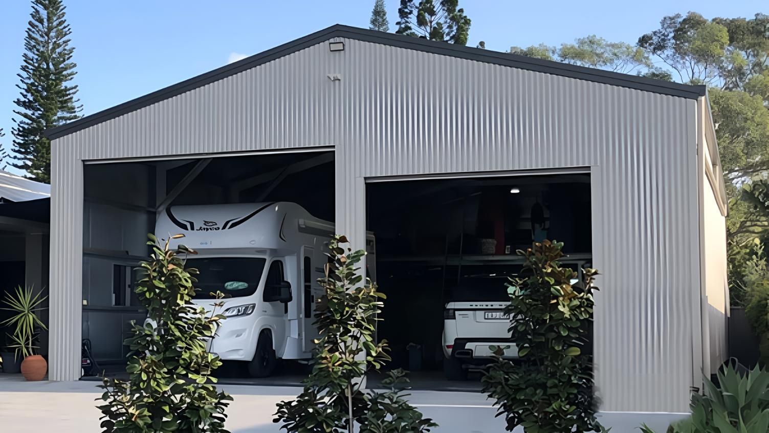 A Rv is Parked in a Garage With the Doors Open — Hastings Valley Sheds in South West Rocks, NSW