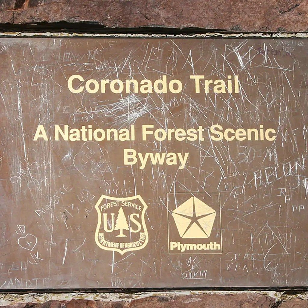A sign that says coronado trail a national forest scenic byway