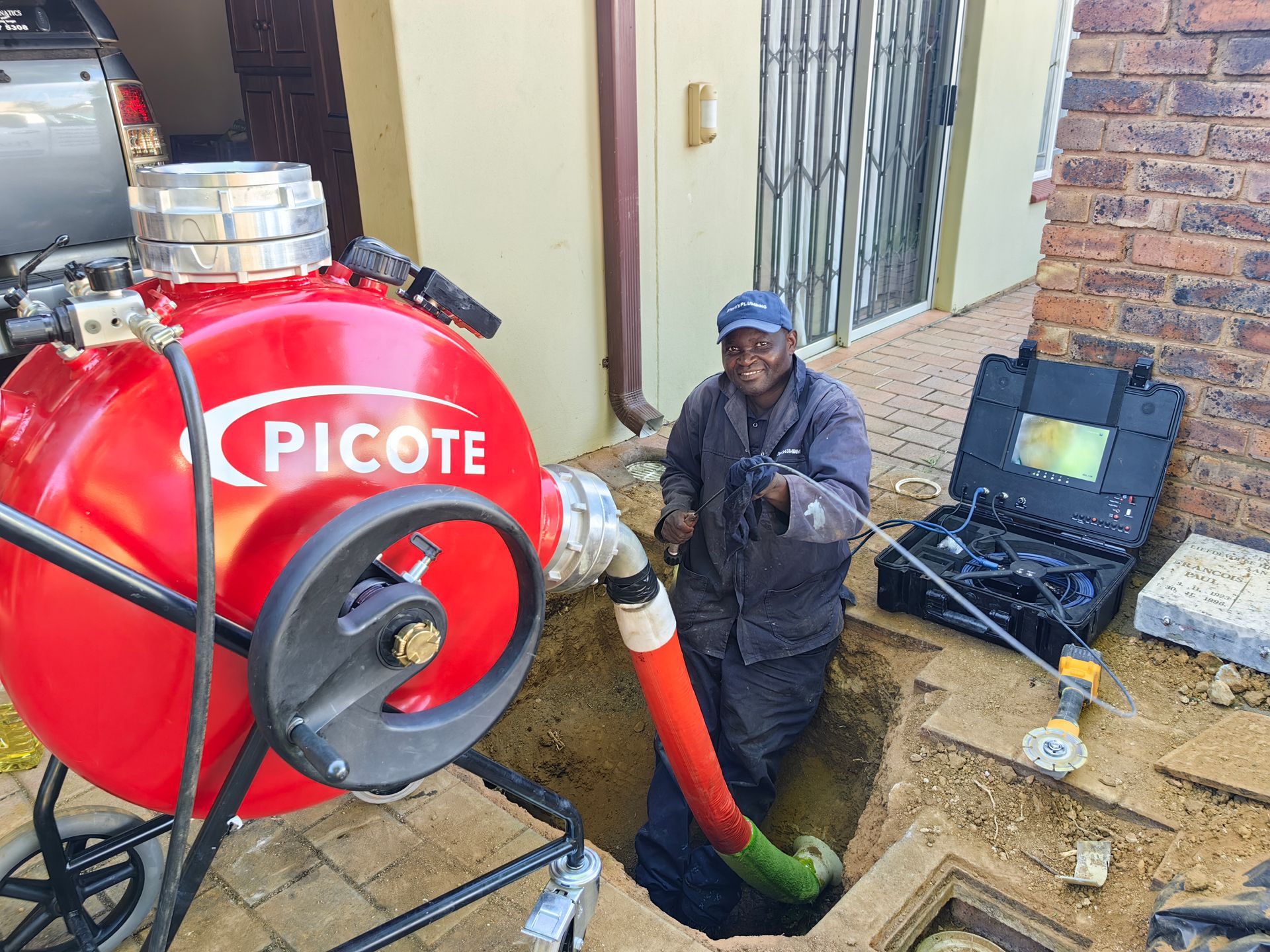 A red Picote tank is being used by Steyn's Plumbing in Garsfontein to reline old pipes.