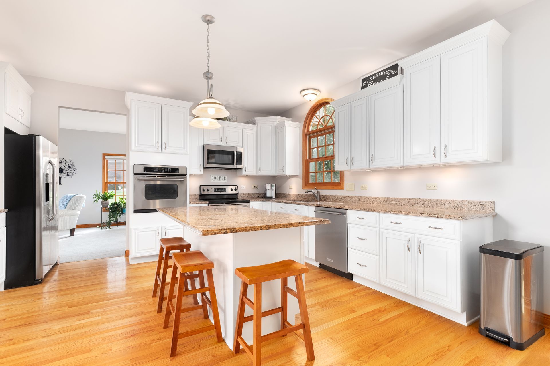 A Kitchen With White Cabinets