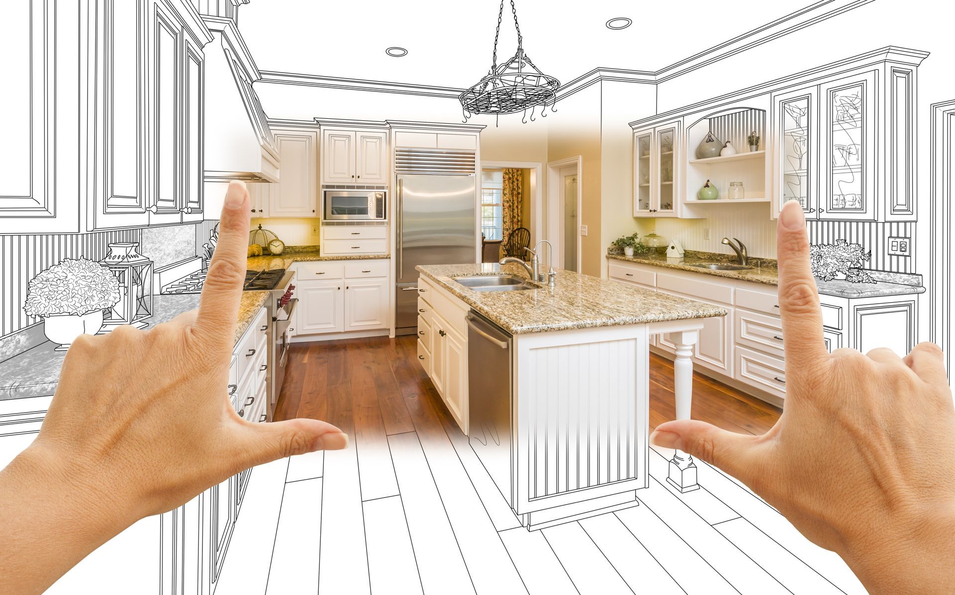 A Person is Framing a Picture of a Kitchen With Their Hands