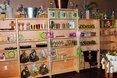 Wooden shelves displaying various products in a store.