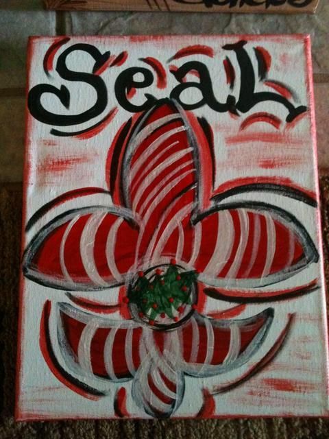 Painting of a stylized red and white flower with