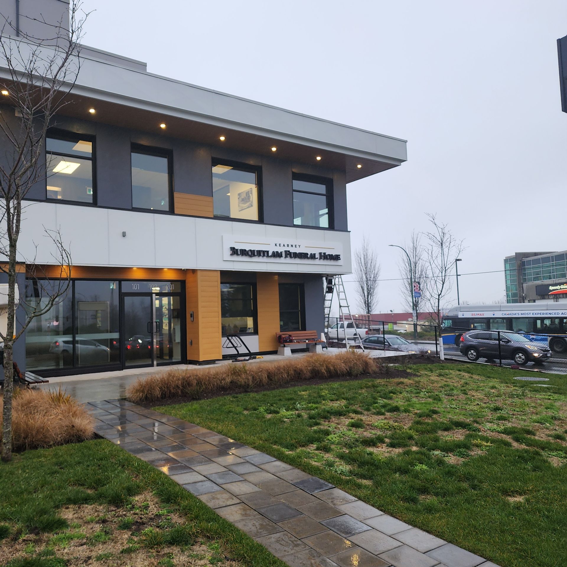 A modern two-story building labeled 