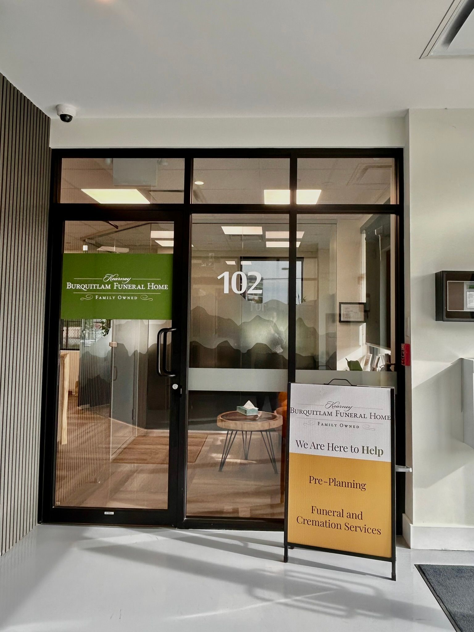 Office entrance with glass door labeled 