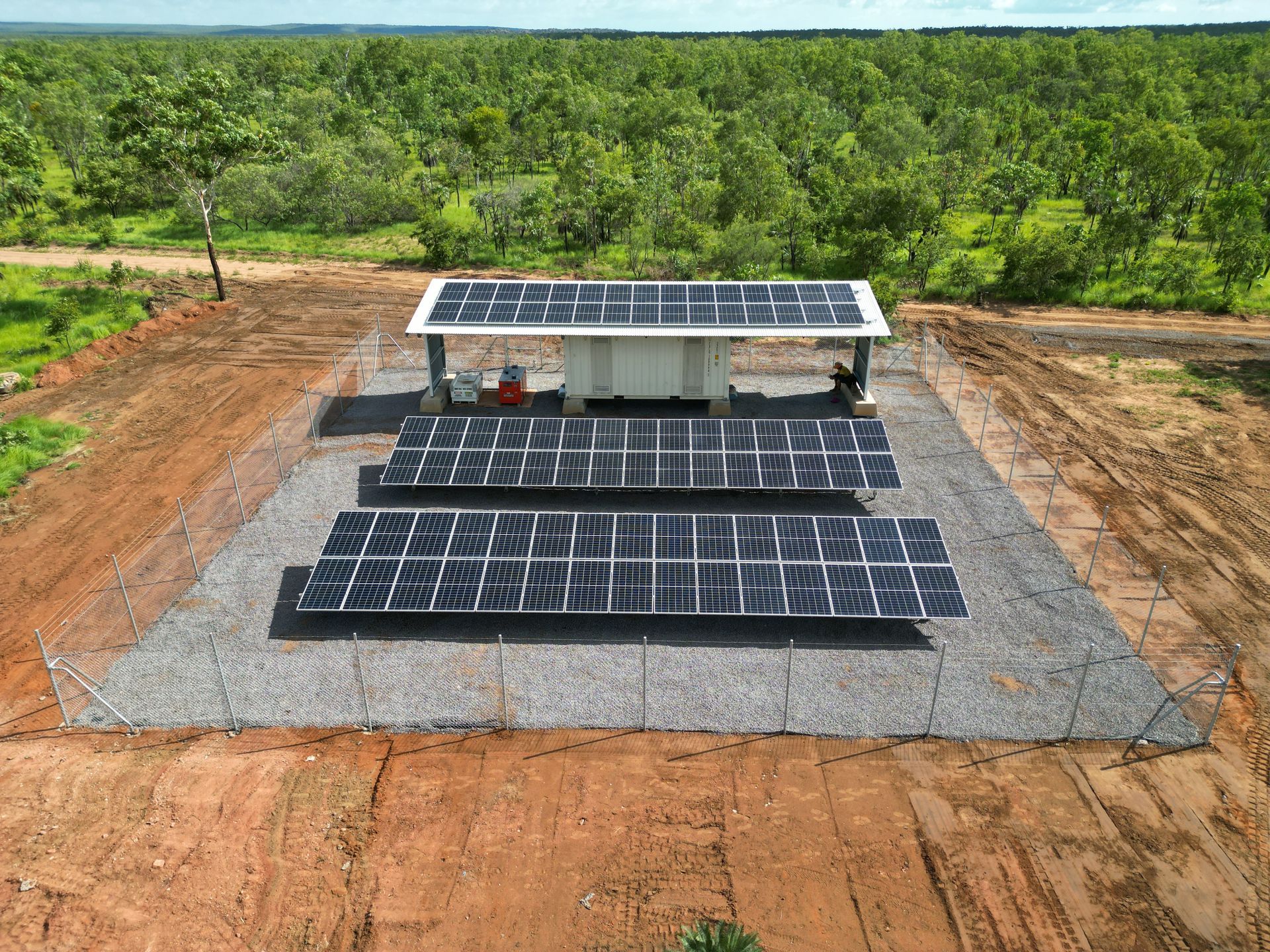 Rows of Solar Panels Angled Towards the Sun in a Vast, Open Area — Inland Electrical in Humpty Doo, NT