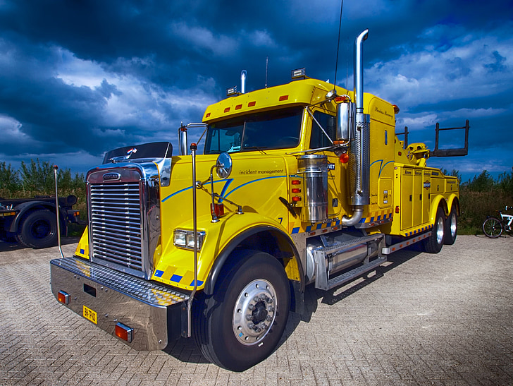 yellow tow truck parked and ready for roadside assistance Hamilton ON services